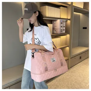 Pink quilted travel duffel bag with bottom shoe compartment, large capacity gym bag for women.
