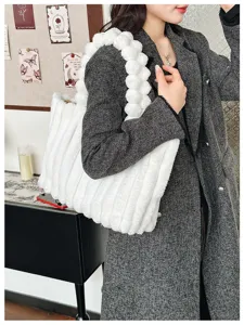 Plush tote bag detail view, soft winter handbag for women, casual fluffy shoulder bag.