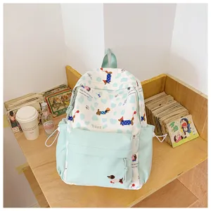 Light green cute puppy print school backpack, stylish ins daypack for teen girls daily use now.