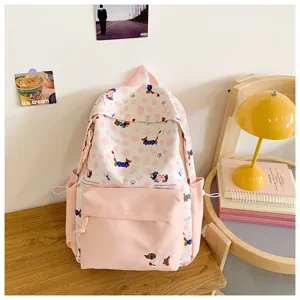 Close-up detail view of the cute pink and white student backpack with adorable puppy print.