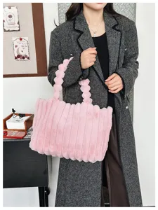 Pink plush tote bag detail showing soft fluffy faux fur texture and unique bubble handles.