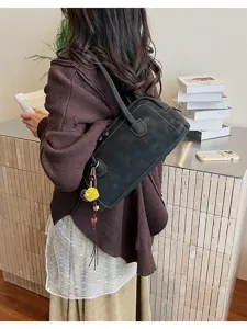 Vintage black shoulder bag for women, large capacity faux leather pillow bag with stylish white stitching.
