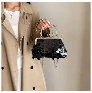 Women's black sequin chain crossbody bag, elegant metallic kiss-lock closure shoulder bag.