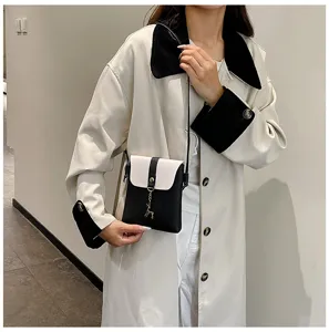 Chic black and white mini crossbody phone bag with deer charm, perfect for daily fashion.