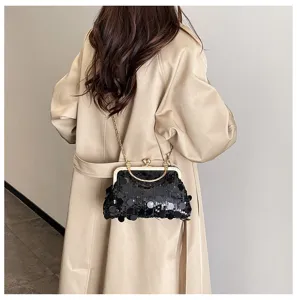 Detail view of a stylish black sequin kiss-lock shoulder chain bag, modern women fashion.