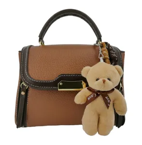 Brown color-block women shoulder bag with cute bear pendant, stylish crossbody handbag.