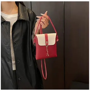 Chic red and white mini crossbody phone bag with cute deer pendant for women daily use.