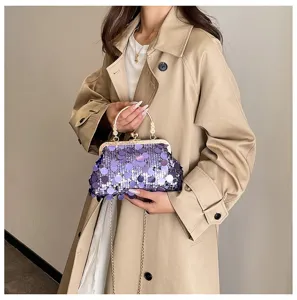 Detailed view of fashionable purple sequin shoulder chain bag with metal clasp closure.