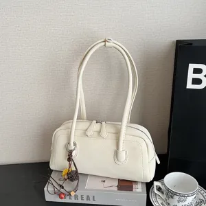 Chic beige shoulder pillow bag for women, stylish retro PU leather tote handbag daily commute.