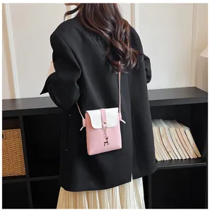 Details of stylish pink and white mini phone crossbody bag with cute deer pendant, perfect for daily fashion look.