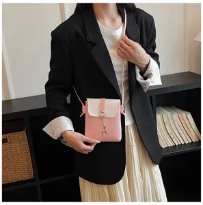 Chic mini pink and white crossbody phone bag, featuring a cute deer charm and slim strap.