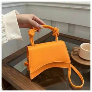 Solid color women handbag, stylish single shoulder crossbody bag with unique knot handle.
