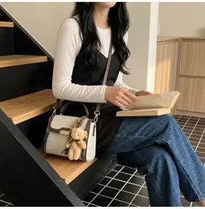 Stylish contrast color shoulder handbag for women, patchwork design with cute bear.
