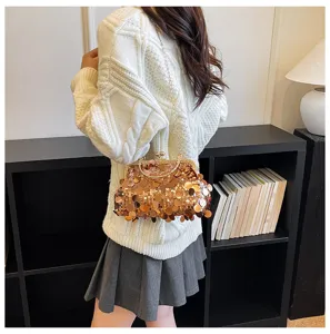 Detail view of the elegant sequin crossbody bag, showing texture and clasp design.