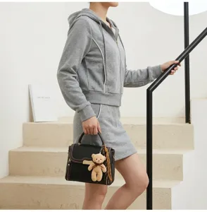 Elegant black contrast color women handbag with cute teddy bear charm simple daily shoulder bag