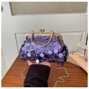 Fashion purple sequin clutch bag with metal frame and chain strap for women chic daily wear.