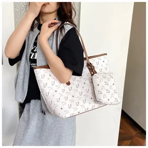 Detailed view of women large capacity tote shoulder bag with vintage swan pattern and brown trim.