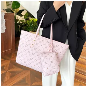 Detail view of pink swan pattern tote bag with matching pouch, elegant shoulder commuter bag.