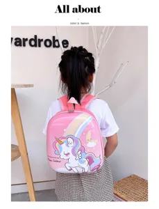 Detailed view of the cute pink hard-shell unicorn backpack for kids, showcasing cartoon graphic.