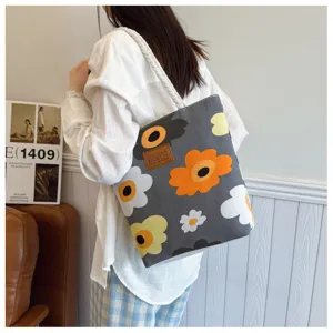 Stylish canvas tote bag with colorful floral print, large capacity casual shoulder bag.