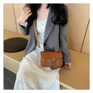 Stylish vintage monogram brown crossbody bag for women with chic leather trim and metal buckle.