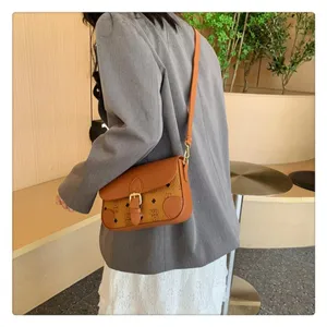 Classic monogram leather shoulder bag with flap closure and adjustable strap for women.