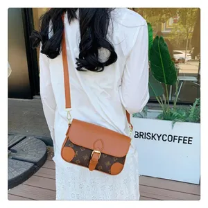 Stylish brown monogram shoulder bag with adjustable strap and retro design for women daily use.