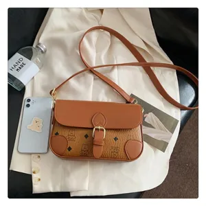 Detailed view of brown retro crossbody shoulder bag with cute bear pattern and metal buckle.