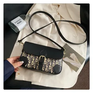 Stylish women's black and white monogram shoulder bag crossbody bag with chic flap and metal buckle.