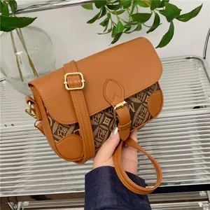 Stylish brown crossbody bag for women, retro geometric pattern shoulder bag with chic metal buckle.