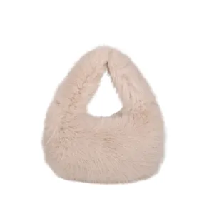 Borsa a mano soffice in ecopelliccia da donna, elegante borsa peluche invernale alla moda.