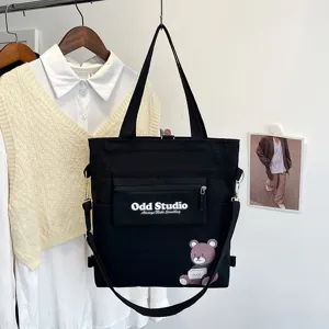 Schwarze Canvas Tragetasche vielseitiger Rucksack Umhängetasche College Stil Druck