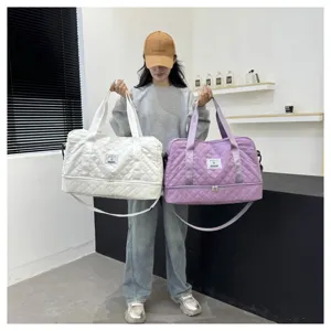 Large capacity quilted travel duffel bag with wet dry separation for fitness yoga casual use detail.