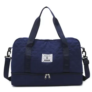 Large capacity quilted travel duffel bag with bottom shoe compartment for gym sports yoga.
