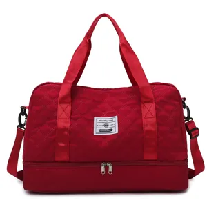 Red quilted travel duffel bag with bottom shoe compartment for gym sports fitness and yoga.