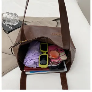 Large capacity brown PU leather tote bag, perfect for daily commute and casual use, showing interior.