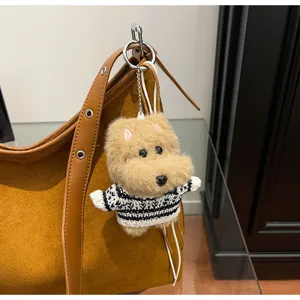 Cute fluffy dog plush keychain featuring a striped sweater, perfect for trendy bags.