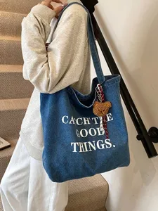 Casual denim canvas tote bag for women, large capacity shoulder shopping bag style.