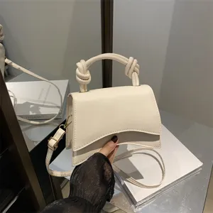 Solid color top handle shoulder bag for women, stylish commuting crossbody square bag with knot.