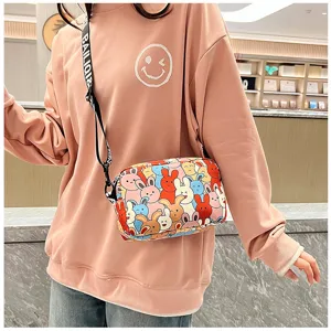 Detail view of colorful cartoon rabbit print women crossbody bag with alphabet strap.