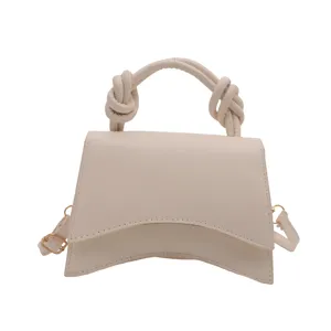 Solid color top handle shoulder crossbody bag for women, chic commuting fashion handbag.