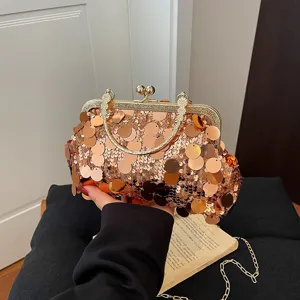 Sparkling sequin clutch bag for women, elegant metal kiss-lock frame with chic chain strap.