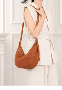 Chic brown leather crescent shoulder bag for women, versatile soft hobo crossbody daily style.