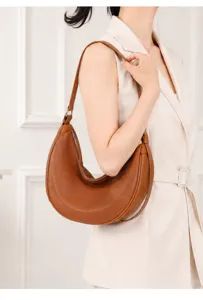 Genuine leather crescent shoulder bag for women, stylish brown hobo underarm bag.