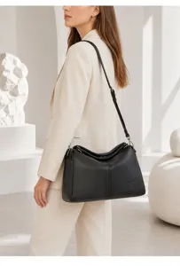 Detail view of women genuine leather boston shoulder crossbody bag in sleek black finish.