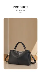 Black genuine leather Boston handbag detail, stylish commuter shoulder bag with metal hardware.