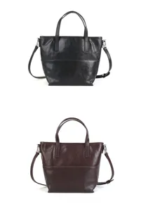 Detailed view of the minimalist genuine leather tote bag showing fine texture and stitching.