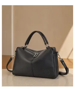 Genuine leather Boston handbag for women, elegant black shoulder and crossbody bag for commute.
