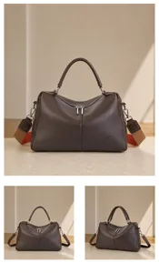 Leather boston bag detail view showing fine craftsmanship and chic multi-angle design.