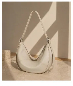 Premium leather crescent shoulder bag, soft hobo purse with secure zip closure and chic style.